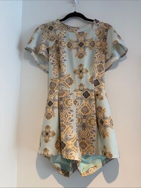 Women' Light Blue Paisley Romper with tie back feature